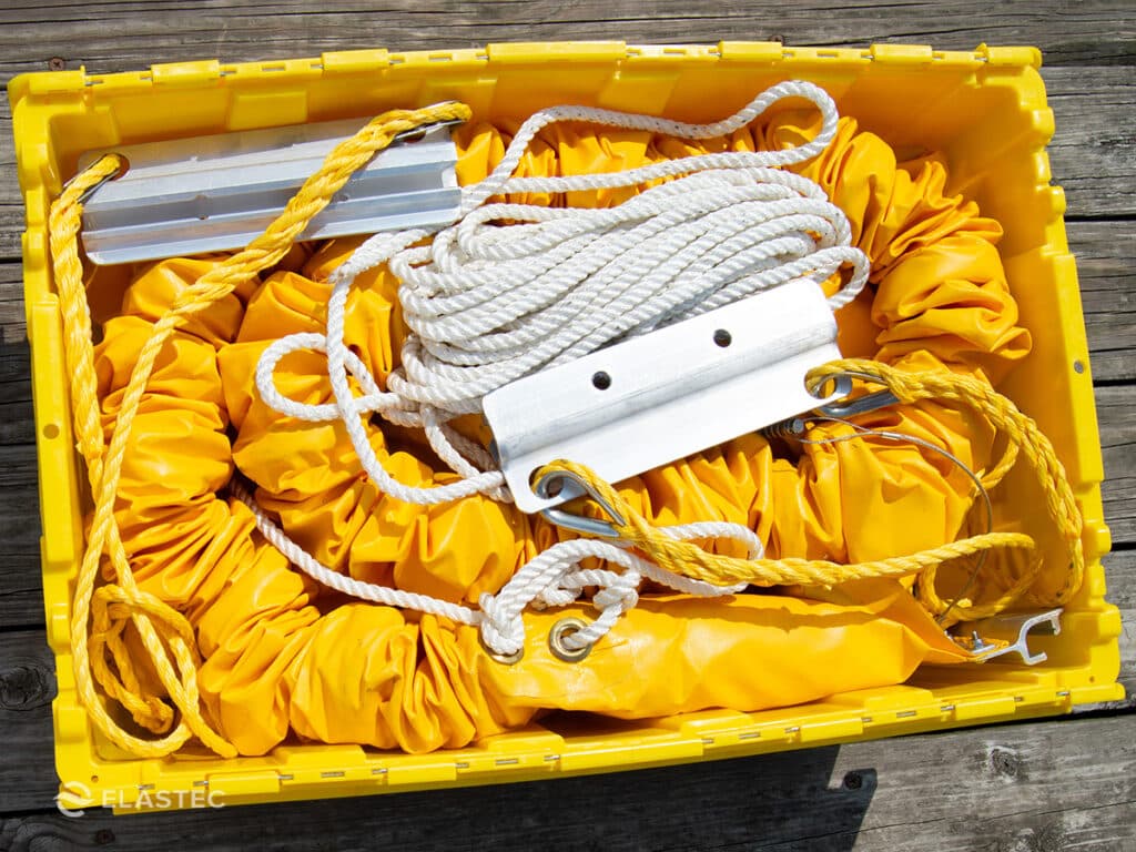 Instant containment boom for oil spill response