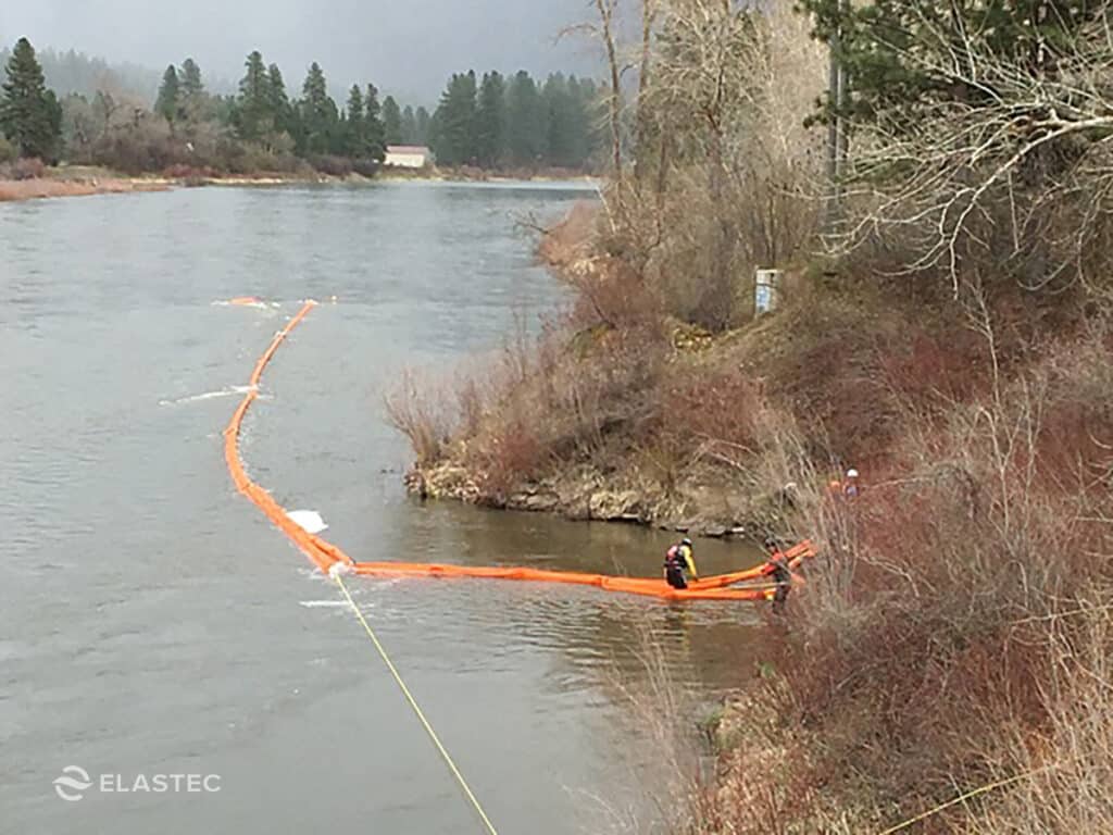 Boom deflector deployment in river